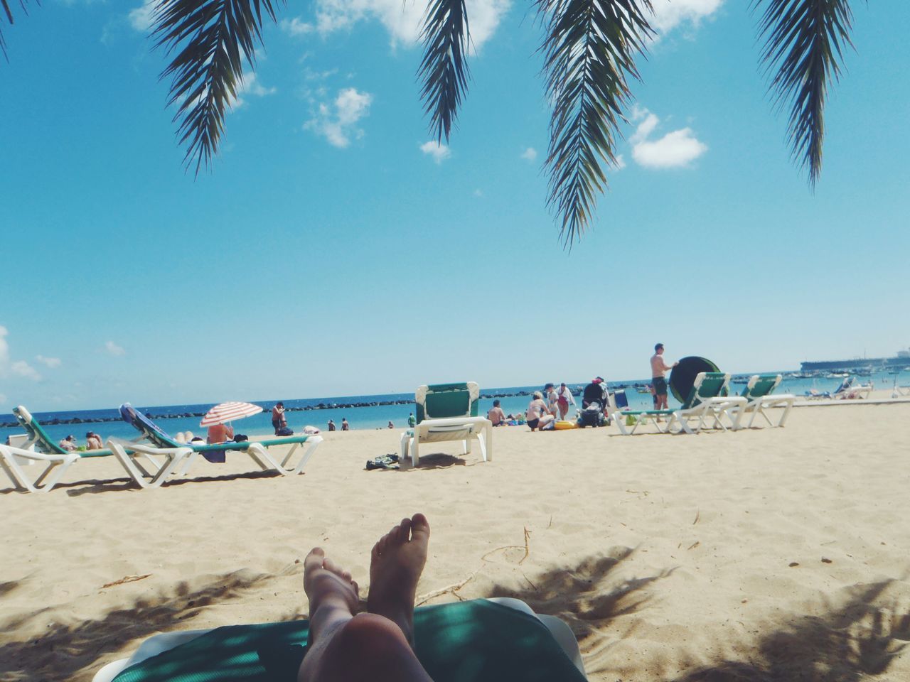 beach, sand, sea, shore, water, horizon over water, vacations, beach umbrella, sky, relaxation, tranquility, summer, tranquil scene, lounge chair, scenics, leisure activity, blue, sunlight, beauty in nature