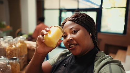 Young woman drinking juice