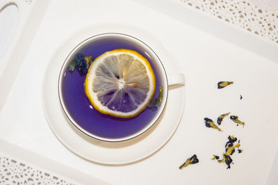 High angle view of lemon in plate on table