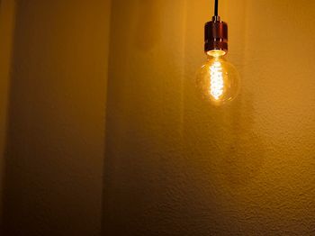 Low angle view of illuminated light bulb