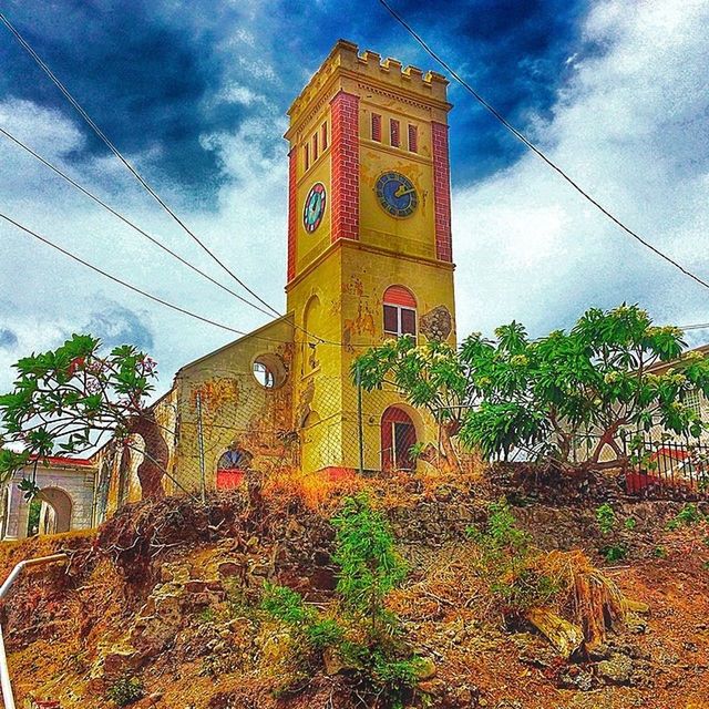 architecture, built structure, building exterior, sky, cloud - sky, cloud, low angle view, plant, tree, growth, house, cloudy, day, outdoors, no people, nature, arch, palm tree, residential structure, religion