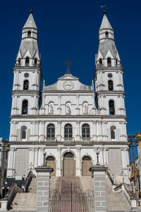 Low angle view of building against blue sky