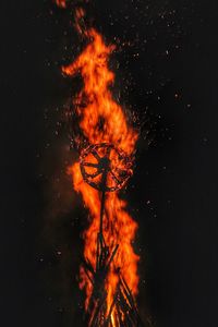 Low angle view of bonfire against sky at night