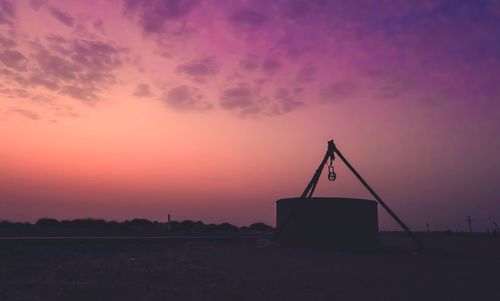 Scenic view of silhouette land against sky during sunset