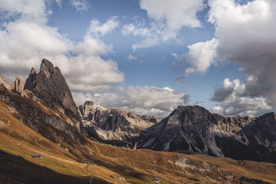 Scenic view of mountain against cloudy sky