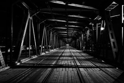 Illuminated bridge at night