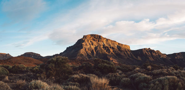 Rock formations on landscape against sky