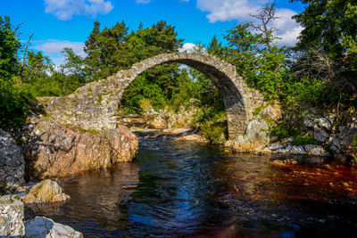 Arch bridge over river