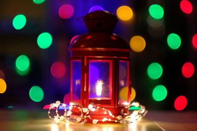 Close-up of illuminated christmas lights on table