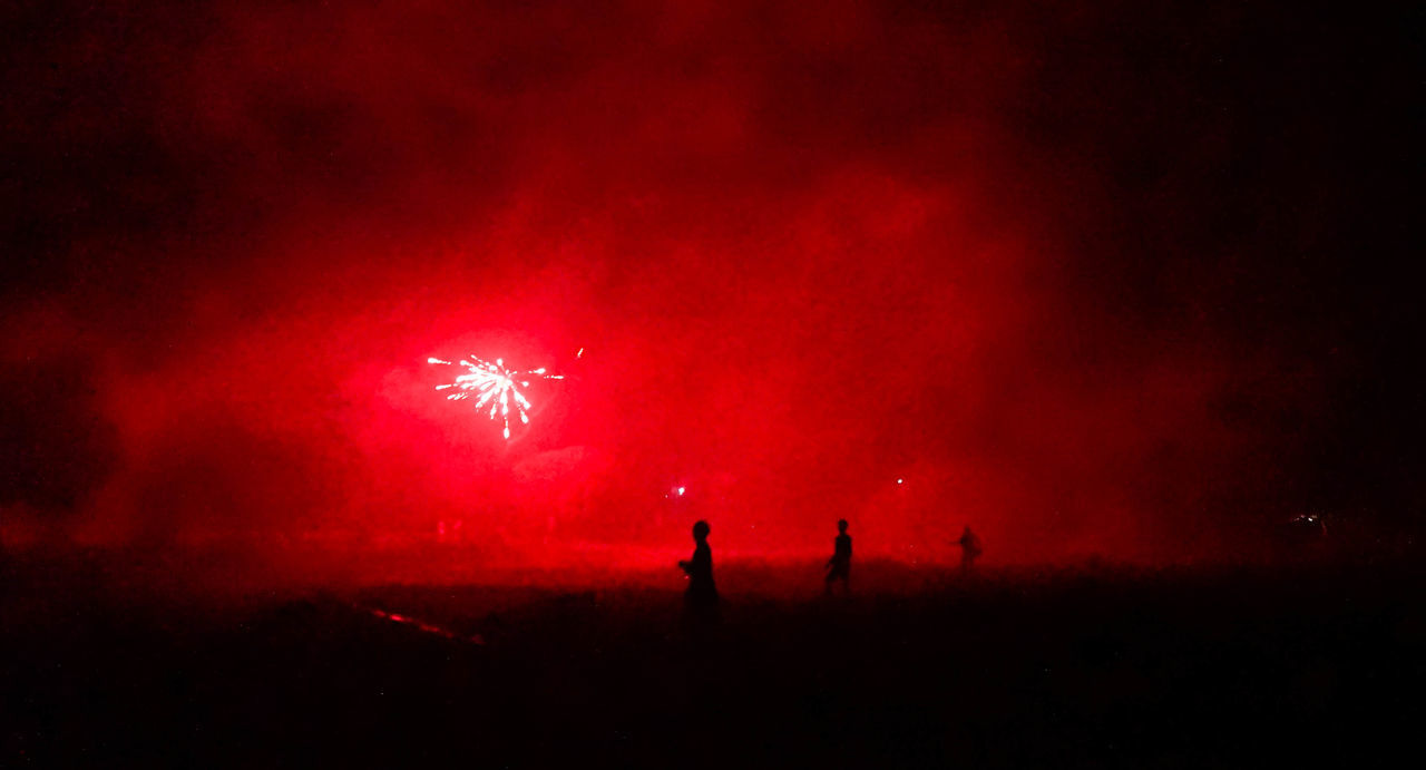 SILHOUETTE PEOPLE WATCHING FIREWORK DISPLAY