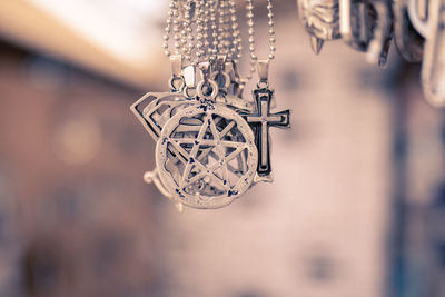 Close-up of chain hanging on metal structure