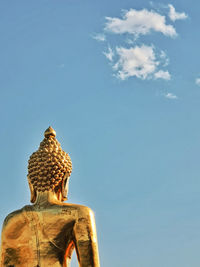 Low angle view of statue against sky