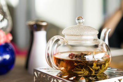 Close-up of herbal tea in kettle on table
