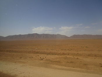 Scenic view of desert against sky