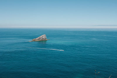 High angle view of calm blue sea against clear sky