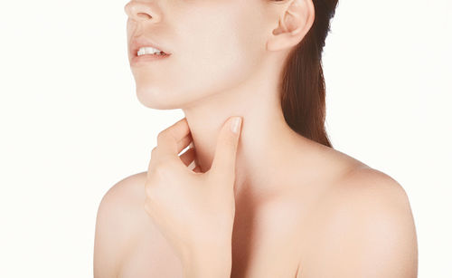 Portrait of a beautiful young woman over white background