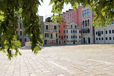 Buildings by street in city