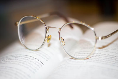 Close-up of eyeglasses on book