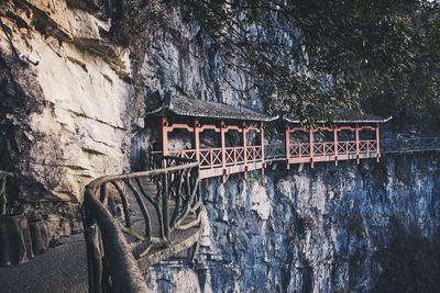 Built structure by plants against wall