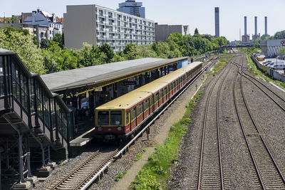 Train on railroad tracks in city