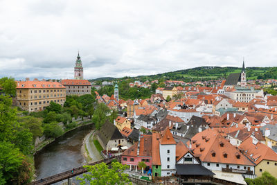 Buildings in town against sky