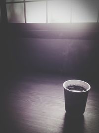 Close-up of coffee cup on table