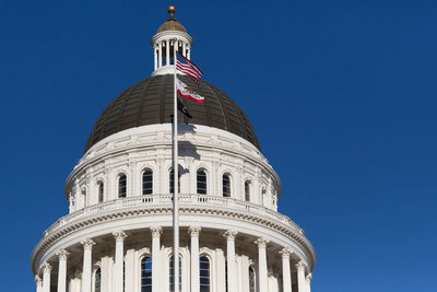 Low angle view of building against blue sky