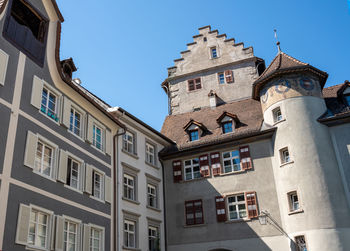 Low angle view of buildings against blue sky