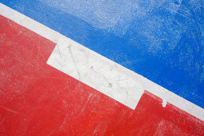 High angle view of arrow sign on wall