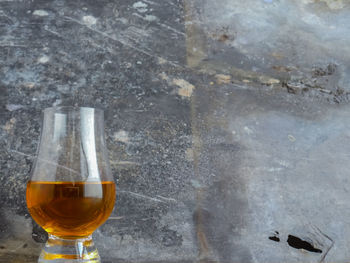 Close-up of beer glass on table