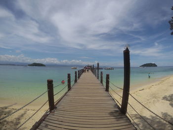 Pier over sea against sky