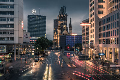 Light trails on road in city at night