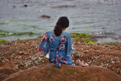 Rear view of woman on beach