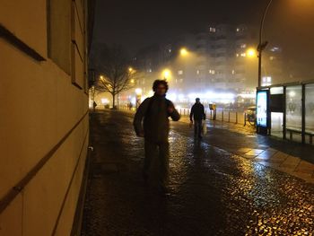 Blurred motion of people in city at night