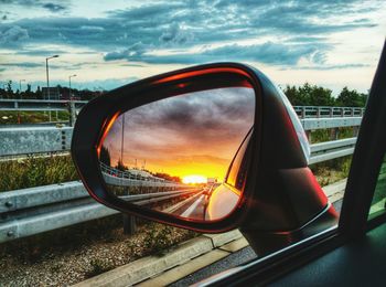Reflection of car on road at dusk