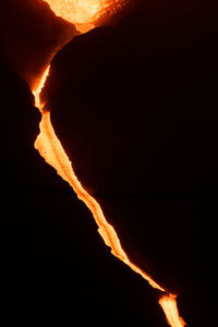 Close-up of fire on mountain at night