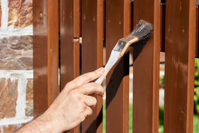 Close-up of hand working on wood