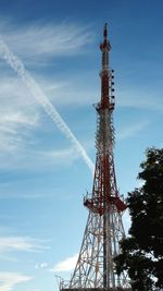 Low angle view of communications tower against sky