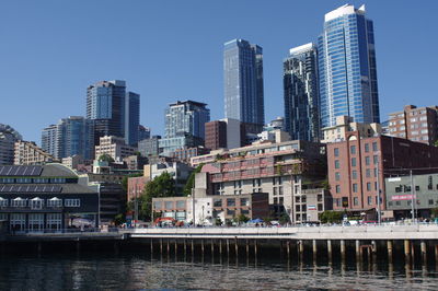 Modern buildings in city against clear sky