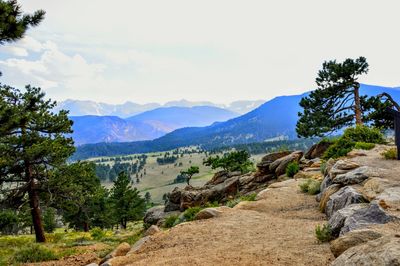 Scenic view of mountains against cloudy sky