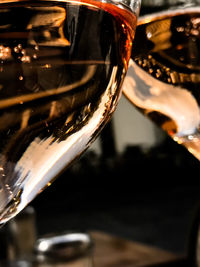 Close-up of hand holding beer glass
