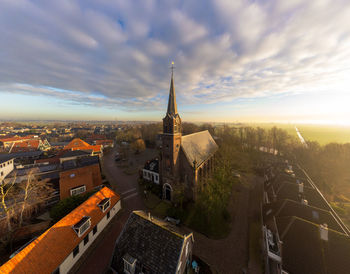 Sunset in ilpendam. aerial shot made by drone of a dutch town at sunrise