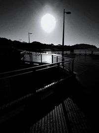 View of bridge over river at sunset