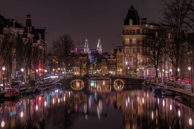 Reflection of illuminated buildings in water