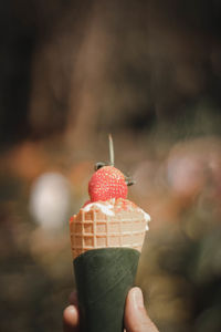 Hand holding ice cream