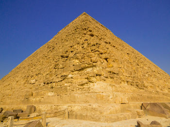 Low angle view of historical building against blue sky