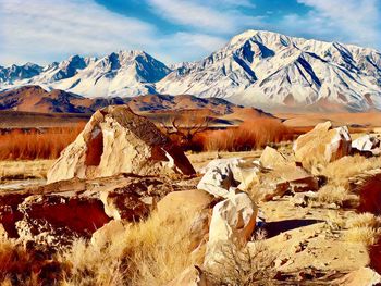 Scenic view of snowcapped mountains against sky