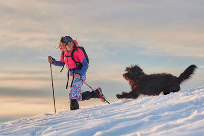 Person with dog on snow