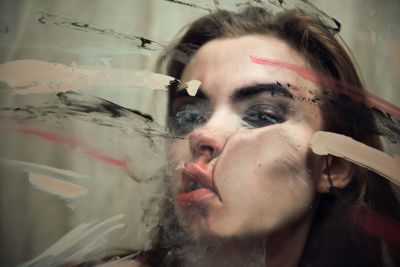 Close-up portrait of woman smoking