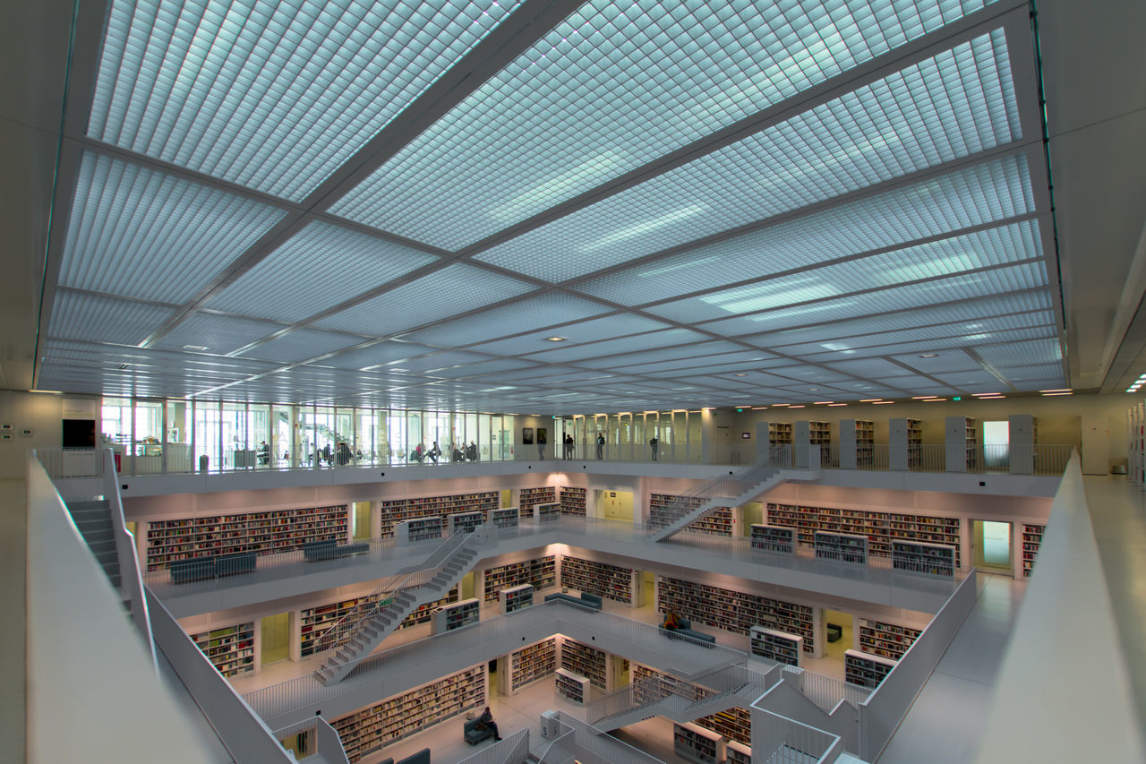 indoors, architecture, built structure, ceiling, illuminated, business, railing, building, no people, day, high angle view, modern, diminishing perspective, lighting equipment, pattern, glass - material, window, absence, architectural column, luxury